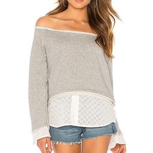 Off shoulder sweater with eyelet hem